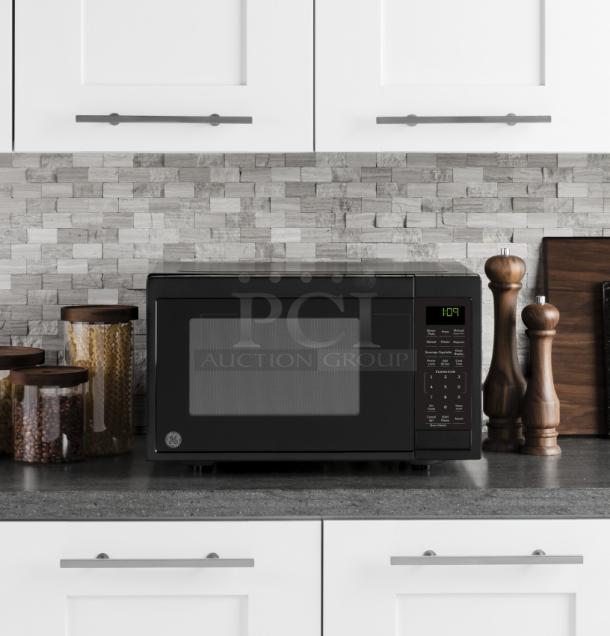 BRAND NEW GE 0.9 Cu. Ft. Countertop Microwave, Model GCST09N1WBB, black finish, minor scratches.