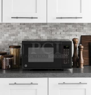 BRAND NEW GE 0.9 Cu. Ft. Countertop Microwave, Model GCST09N1WBB, black finish, minor scratches.