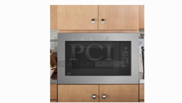 GE Profile 2.2 cu. ft. built-in sensor microwave PCWK22U1WDD, gray, sleek design, control panel, modern kitchen setting.