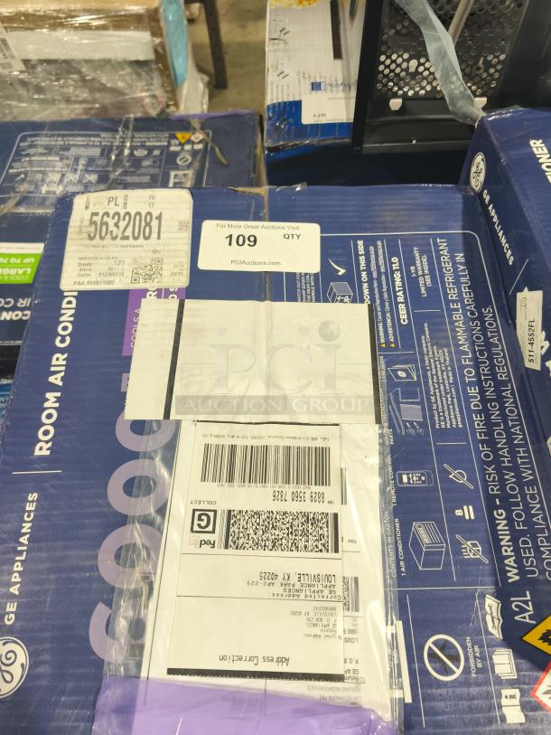 BRAND NEW SCRATCH AND DENT GE 6,000 BTU Window Air Conditioner, model AWFS06BWL, for rooms up to 250 sq ft. Box shows shipping labels and item codes.
