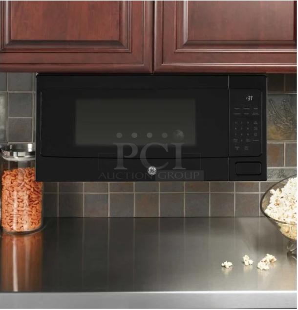 BRAND NEW GE Profile countertop microwave, 1.1 Cu. Ft., black, model PCHK11S1WBB, with minor scratches and dents.