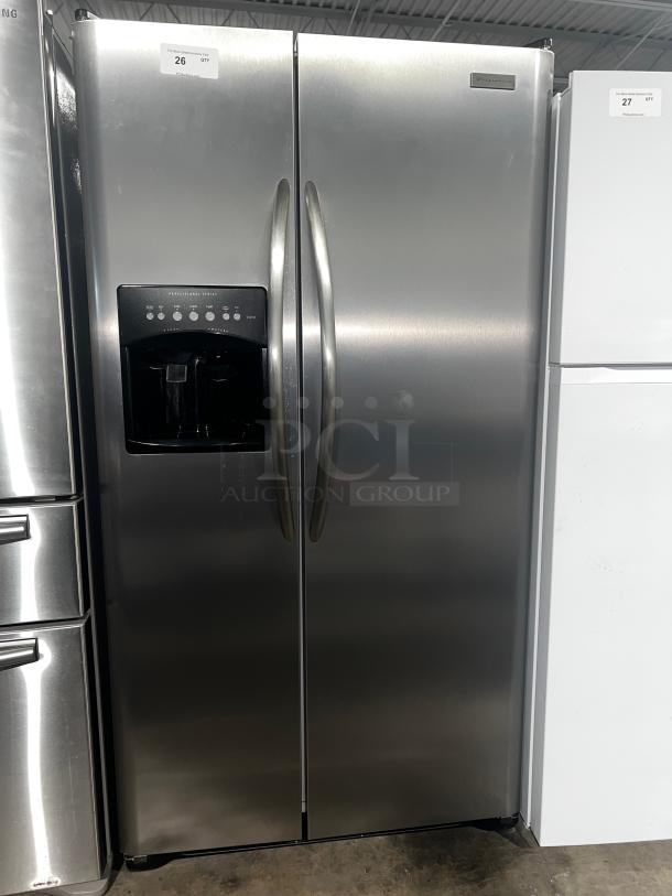 Frigidaire Gallery 22.6 Cu. Ft. Side-by-Side Refrigerator, model PHSC39EESS, stainless steel, with water dispenser, excellent condition.