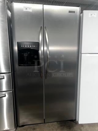 Frigidaire Gallery 22.6 Cu. Ft. Side-by-Side Refrigerator, model PHSC39EESS, stainless steel, with water dispenser, excellent condition.