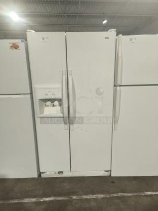 Kenmore Coldspot Model 10657362700 refrigerator, white, side-by-side doors, built-in water and ice dispenser, minor scratches.