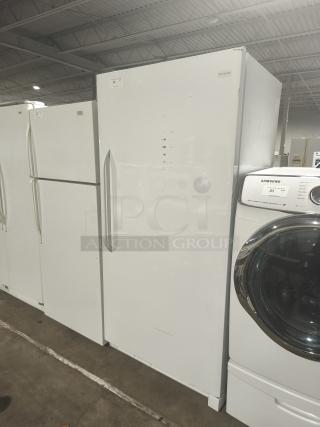 Frigidaire FFFH20F2QWF freezer with 4 adjustable wire shelves, 6 door racks, automatic defrost, and keyed door lock.
