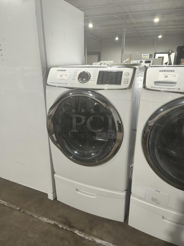 SAMSUNG electric dryer, model DV45H6300EW/A3, in white. Features 13 dry cycles, steam, sensor, and reversible door.