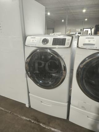 SAMSUNG electric dryer, model DV45H6300EW/A3, in white. Features 13 dry cycles, steam, sensor, and reversible door.