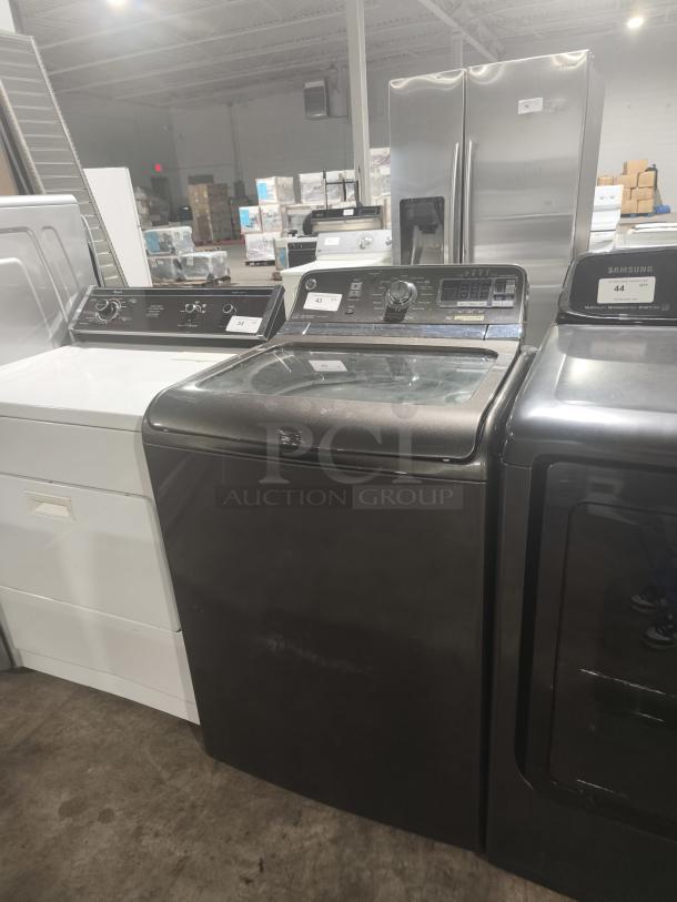 GE® 5.0 cu. ft. washer, model GTWS8655D0MC, stainless steel basket, steam feature, gently used condition.
