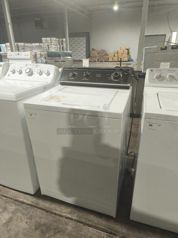 Whirlpool LA5580XTW1 washer, white, top-loading, visible control panel, used condition, auction label attached.