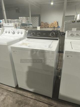 Whirlpool LA5580XTW1 washer, white, top-loading, visible control panel, used condition, auction label attached.