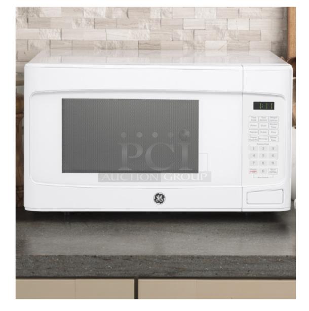 BRAND NEW SCRATCH AND DENT GE® 1.1 Cu. Ft. White Countertop Microwave Oven, Model GCST11N1WWW, visible control panel.