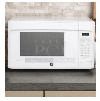 BRAND NEW SCRATCH AND DENT GE® 1.1 Cu. Ft. White Countertop Microwave Oven, Model GCST11N1WWW, visible control panel.