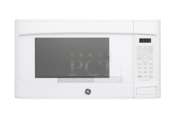 BRAND NEW GE 1.1 Cu. Ft. White Countertop Microwave Oven, Model GCST11N1WWW, featuring digital controls and display.