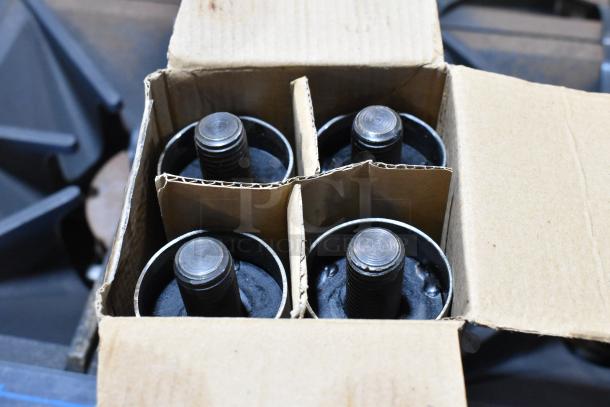 Box with four black burners, packed with cardboard dividers, part of the Southbend 4601DD 10 Burner Range set.