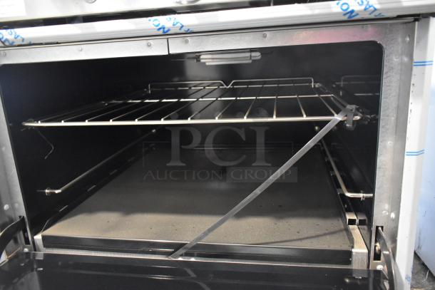 BRAND NEW Southbend 4601DD stainless steel 10-burner range with 2 ovens, natural gas powered, featuring a back splash.