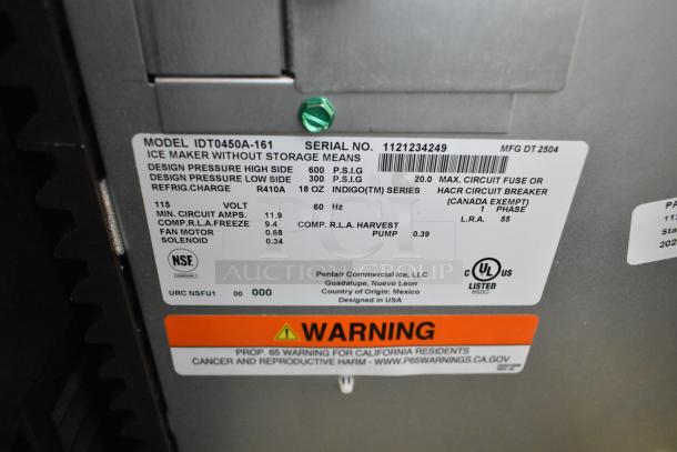 "Label on 2025 Manitowoc IDT0450A-161 ice machine, showing model, serial number, voltage, certification, and warning details."