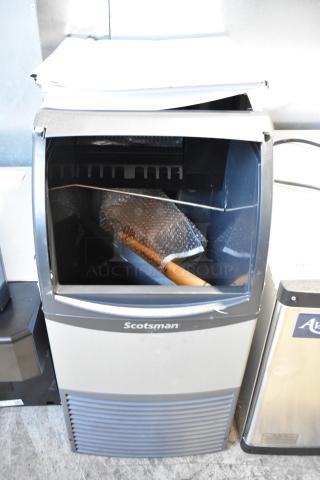 BRAND NEW 2023 Scotsman CU0415MA-1A stainless steel undercounter ice machine, 58 lb capacity, 115V, minor dents visible.