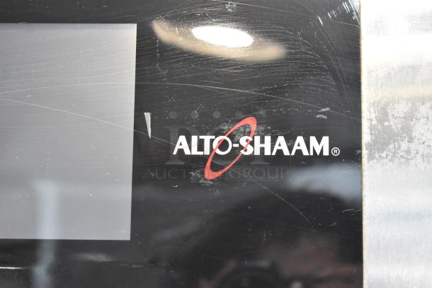 Alto Shaam CTX4-10EC combi oven front panel with logo, showing minor surface scratches.