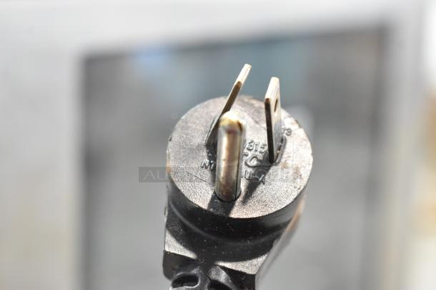 Close-up of a three-prong power plug attached to the Alto Shaam CTX4-10EC combi oven, showing electrical specifications.