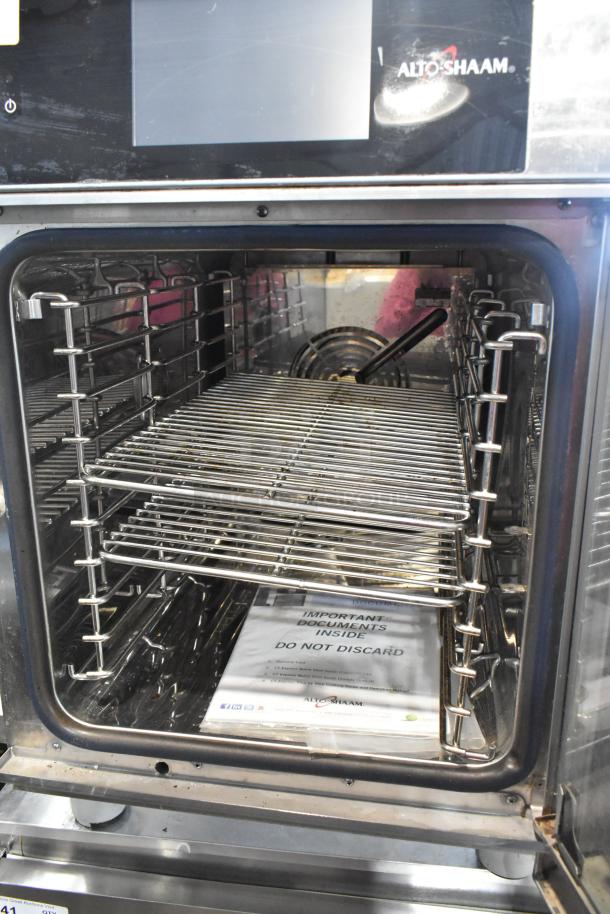 2016 Alto Shaam CTX4-10EC stainless steel 5 pan combi oven with express controls, catalytic converters, visible document packet inside.