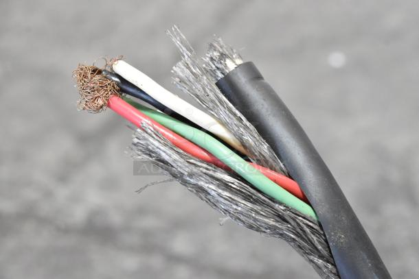 A close-up of frayed electrical wire with exposed copper and multiple colored insulation, indicating wear or damage.