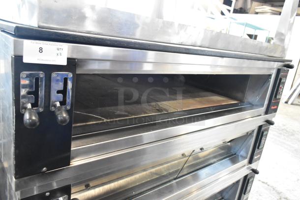 Three Pavailler stainless steel single deck bakery/pizza ovens, 250V, 1 phase, commercial use, good condition, control panel visible.