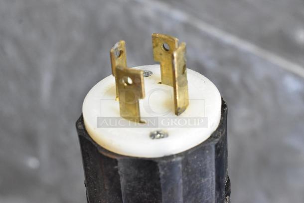 Close-up of an electric plug for Pavailler stainless steel commercial ovens. Plug features three prongs, 250 volts, 1 phase.