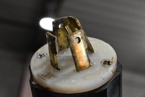Close-up view of a plug component from a Pavailler stainless steel commercial bakery/pizza oven, showing wear.