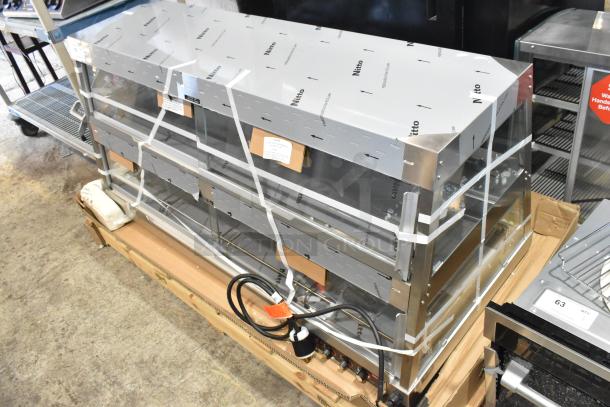 Brand new Hatco GRHD-4PD stainless steel heated display case. 58 1/2" countertop, 120/208 volts, 1 Phase. Tags attached.