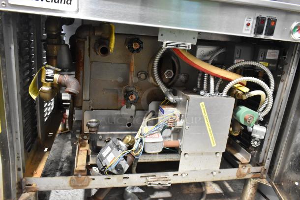 Cleveland PGM3002 stainless steel propane gas pressure steam cabinet, visible wiring and components, commercial use.