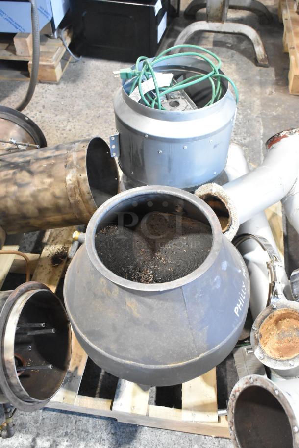 US Roaster Corp metal commercial coffee bean roaster components on a pallet, natural gas-powered, 23 kilo capacity.