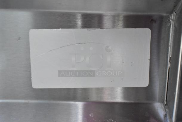 Stainless steel steam table with sneeze guard and under shelf. Features durable construction and sleek design.