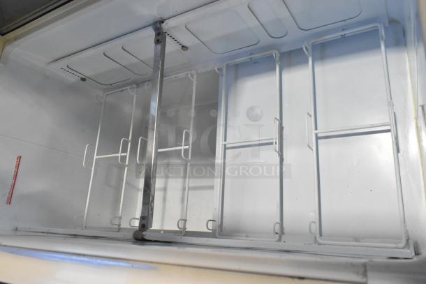 Kelvinator metal commercial ice cream dipping cabinet interior with rack, white finish, good condition, clean design.