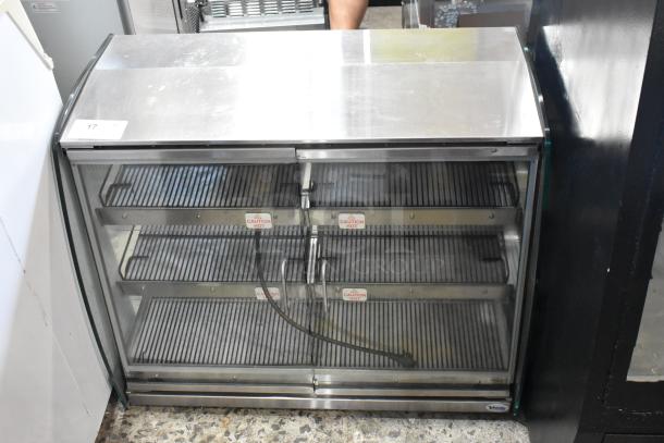 Vendo HFDC00003 metal heated display case, 115V, 1 phase, glass front, stainless steel interior, shelves with "Caution Hot" labels.