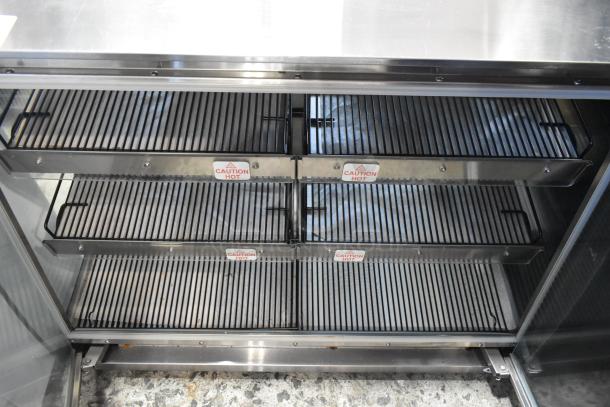 Vendo HFDC00003 metal heated display case. Features stainless steel racks with "Caution Hot" labels. 115 volts, 1 phase.