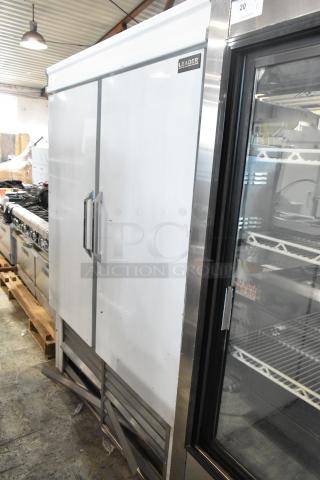 Leader ESFR54 Stainless Steel 2 Door Reach-In Cooler with poly-coated racks, 115 volts, in commercial setting.