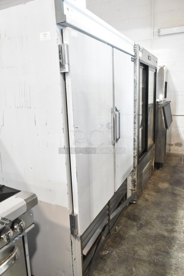 2025 Leader ESFR54 stainless steel 2-door reach-in cooler. Poly coated racks, 115V, 1 phase. Visible scratches.