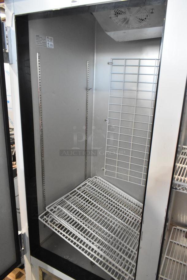Leader ESFR54 stainless steel 2-door commercial cooler with poly-coated racks. 115V, 1 phase, excellent condition.