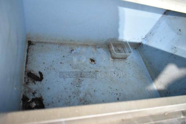 Hoshizaki F-1001MWH stainless steel commercial ice head and bin, interior view with signs of dirt, 208-230V, 1 phase.
