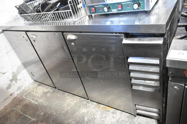 Beverage Air BB72 stainless steel commercial 3-door undercounter cooler. Features 115 volts, 1 phase. Slight wear visible.