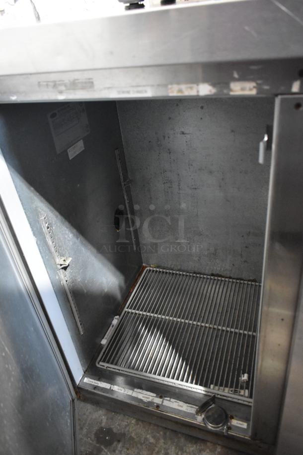 Beverage Air BB72 stainless steel 3-door undercounter cooler, interior view, showing wire shelving; 115 volts, 1 phase.