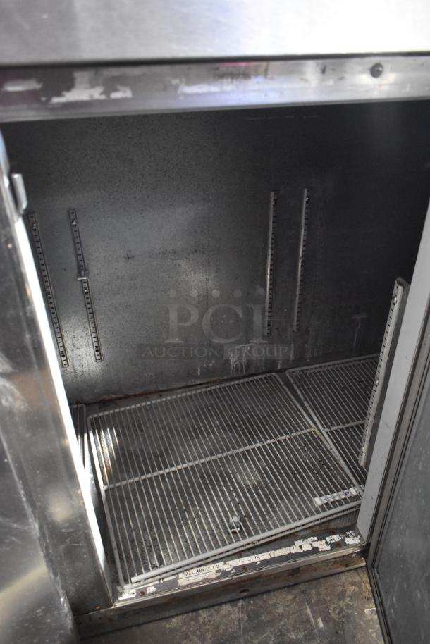 Beverage Air BB72 stainless steel 3-door undercounter cooler interior view, showing shelves and metal finish. 115 volts, 1 phase.