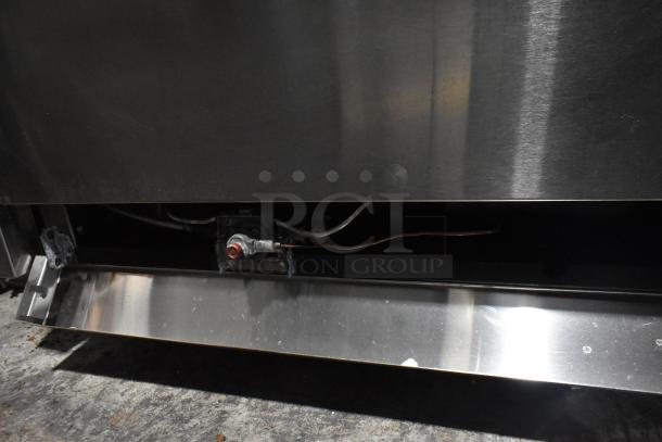 Sierra stainless steel commercial 6 burner gas range with oven, over shelf, and backsplash. Partial side view showing stainless finish.