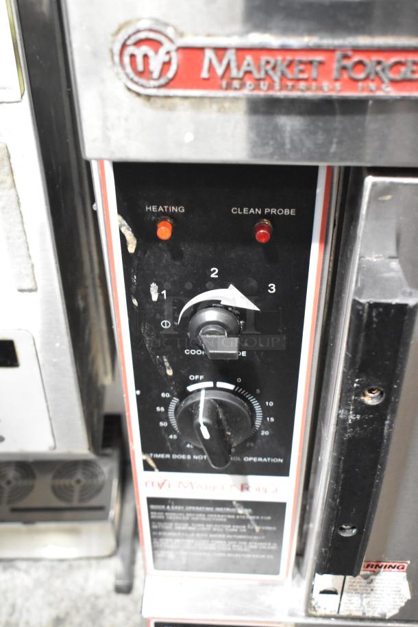 Market Forge stainless steel single deck steam cabinet control panel, showing heating and clean probe indicators. Some wear visible.
