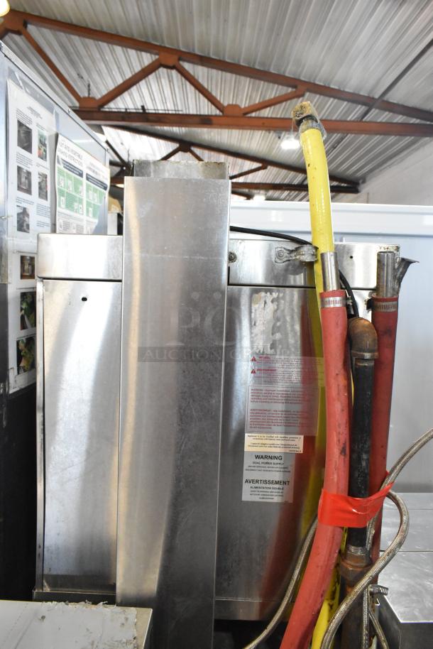 Market Forge stainless steel commercial single deck steam cabinet. Features visible hoses and safety warning labels. Good condition.