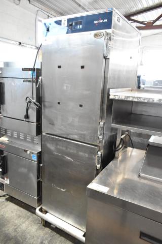 Alto Shaam 1200-UP stainless steel mobile holding cabinet, 16 pan, with Dutch doors and commercial casters, 120V, 1 phase.