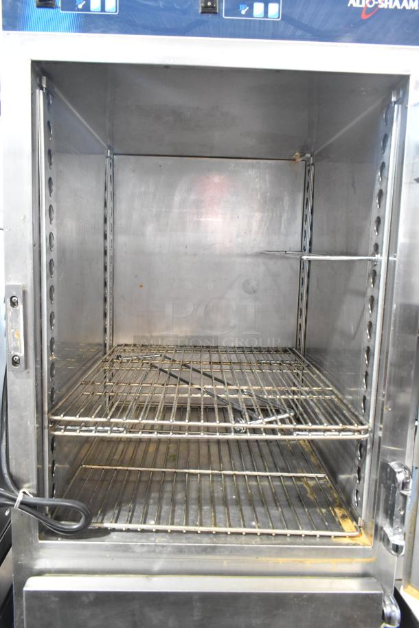 Alto Shaam 1200-UP stainless steel holding cabinet, 16 pan capacity, dutch doors, on commercial casters, 120V, used condition.