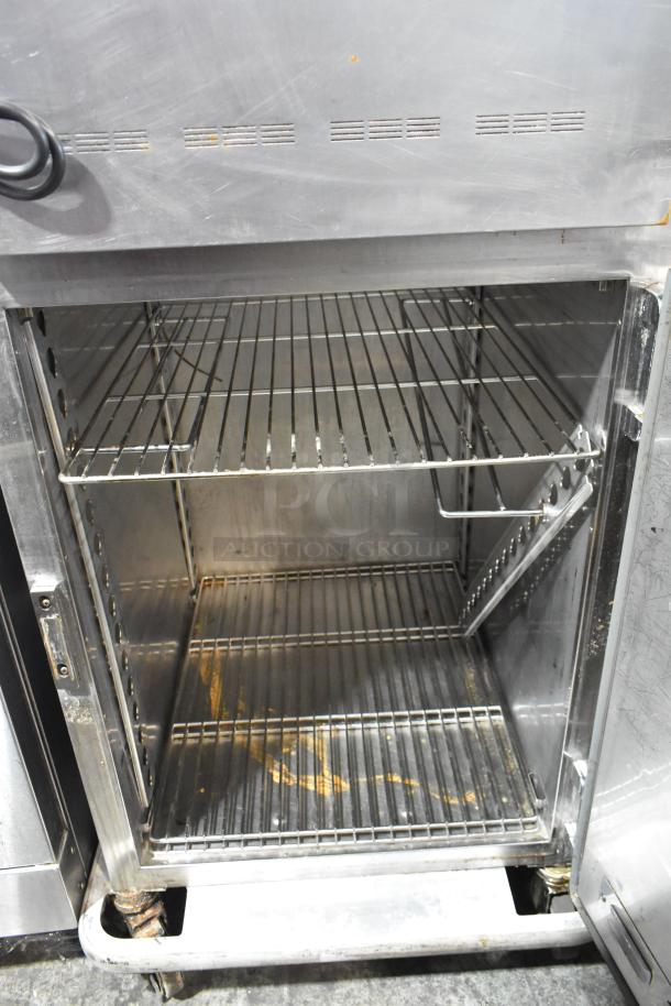 Alto Shaam 1200-UP stainless steel 16 pan Dutch door holding cabinet on casters, 120V, 1 phase, visible wear.