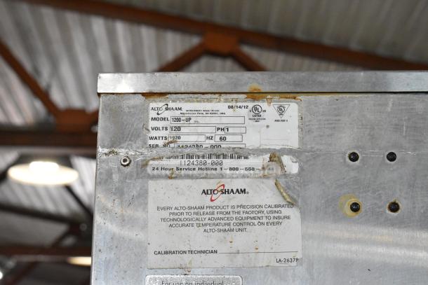 Alto Shaam 1200-UP stainless steel commercial holding cabinet with visible model/voltage label, on commercial casters.