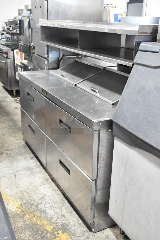 Delfield stainless steel sandwich salad prep table with four drawers, mega top, and over shelf. 115V, 1-phase.
